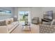 Living room features a comfortable couch, sliding door to backyard at 3428 Costello Cir, Winter Haven, FL 33884