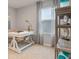Home office features a large desk, window, and shelving at 3428 Costello Cir, Winter Haven, FL 33884