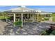Community clubhouse with columns and landscaping at 3900 Southpointe Dr # 127, Orlando, FL 32822