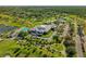 An aerial view of a community center, pool, and parking at 3900 Southpointe Dr # 127, Orlando, FL 32822