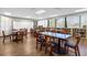 Community room with tables, chairs, and bookshelves at 3900 Southpointe Dr # 127, Orlando, FL 32822