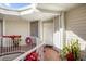 Inviting condo entryway with decorative wreaths and brick-paved flooring at 3900 Southpointe Dr # 127, Orlando, FL 32822