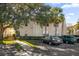 Building exterior showcasing landscaping and parking at 3900 Southpointe Dr # 127, Orlando, FL 32822