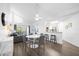 Open living and dining area with gray sofa and hardwood floors at 3900 Southpointe Dr # 127, Orlando, FL 32822