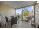 Private screened balcony with patio furniture, ideal for relaxing outdoors at 3900 Southpointe Dr # 127, Orlando, FL 32822
