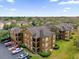 Community overview showcasing building exteriors and green spaces at 412 Summit Ridge Pl # 210, Longwood, FL 32779