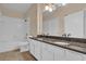 Bathroom boasts a double vanity and granite countertops at 412 Summit Ridge Pl # 210, Longwood, FL 32779