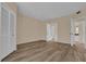 Spacious bedroom with wood floors, a closet with louvered doors, and a view into the ensuite bathroom at 412 Summit Ridge Pl # 210, Longwood, FL 32779