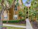 Building exterior showcasing landscaping and walkway at 412 Summit Ridge Pl # 210, Longwood, FL 32779