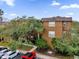 Attractive building exterior with landscaping and ample parking at 412 Summit Ridge Pl # 210, Longwood, FL 32779