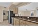 Kitchen with granite countertops and black appliances at 412 Summit Ridge Pl # 210, Longwood, FL 32779