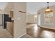 Living room with wood-look floors and access to balcony at 412 Summit Ridge Pl # 210, Longwood, FL 32779