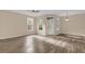 Spacious living room with wood-look floors and lots of natural light at 412 Summit Ridge Pl # 210, Longwood, FL 32779