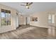 Open living room with wood-look floors and neutral walls at 412 Summit Ridge Pl # 210, Longwood, FL 32779