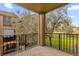Screened balcony overlooking a tree-lined grassy area at 412 Summit Ridge Pl # 210, Longwood, FL 32779