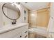 Clean bathroom with a tub and updated vanity at 4153 S Atlantic Ave # 3070, New Smyrna Beach, FL 32169
