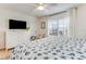 Bedroom with king-size bed, dresser, and TV at 4153 S Atlantic Ave # 3070, New Smyrna Beach, FL 32169