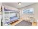 Bedroom with twin-over-twin bunk bed and window at 4153 S Atlantic Ave # 3070, New Smyrna Beach, FL 32169