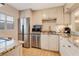 Updated kitchen with granite countertops, stainless steel appliances, and white cabinets at 4153 S Atlantic Ave # 3070, New Smyrna Beach, FL 32169