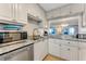 Modern kitchen with granite countertops, stainless steel appliances, and herringbone backsplash at 4153 S Atlantic Ave # 3070, New Smyrna Beach, FL 32169