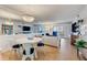 Bright living room with coastal decor, hardwood floors, and a dining area at 4153 S Atlantic Ave # 3070, New Smyrna Beach, FL 32169