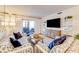 Living room with coastal decor, hardwood floors, and sliding glass doors to balcony at 4153 S Atlantic Ave # 3070, New Smyrna Beach, FL 32169
