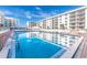 Refreshing community pool with surrounding lounge chairs at 4153 S Atlantic Ave # 3070, New Smyrna Beach, FL 32169