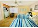 Bedroom with twin beds, dresser and ceiling fan at 4285 Sea Mist Dr, New Smyrna Beach, FL 32169