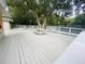 Community deck with picnic tables and tennis court view at 4285 Sea Mist Dr, New Smyrna Beach, FL 32169