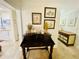Entryway with dark wood desk, decorative wall art, and dresser at 4285 Sea Mist Dr, New Smyrna Beach, FL 32169