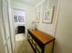 Hallway with dresser and artwork leading to bathroom at 4285 Sea Mist Dr, New Smyrna Beach, FL 32169
