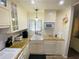 Bright kitchen with granite countertops and white cabinets at 4285 Sea Mist Dr, New Smyrna Beach, FL 32169