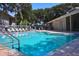 Community pool with surrounding lounge chairs at 4285 Sea Mist Dr, New Smyrna Beach, FL 32169