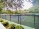 Enclosed community tennis court at 4285 Sea Mist Dr, New Smyrna Beach, FL 32169