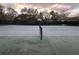 Community tennis court with net, ready for a game at 4285 Sea Mist Dr, New Smyrna Beach, FL 32169