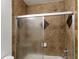 Bathroom with shower/tub combo and tile surround at 4320 S Kirkman Rd # 1502, Orlando, FL 32811