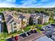 Complex of condo buildings with ample parking at 4849 Cypress Woods Dr # 1310, Orlando, FL 32811