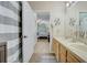 Clean bathroom with double sinks and a shower/tub combo at 4849 Cypress Woods Dr # 1310, Orlando, FL 32811