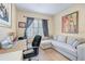 Spacious bedroom with L-shaped sofa and home office area at 4849 Cypress Woods Dr # 1310, Orlando, FL 32811