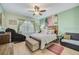 Main bedroom with king-size bed and a massaging chair at 4849 Cypress Woods Dr # 1310, Orlando, FL 32811