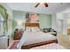Main bedroom with a queen bed and sitting area at 4849 Cypress Woods Dr # 1310, Orlando, FL 32811