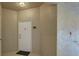 Clean condo entryway with white door and neutral walls at 4849 Cypress Woods Dr # 1310, Orlando, FL 32811
