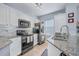 Updated kitchen, granite counters, stainless steel appliances at 4849 Cypress Woods Dr # 1310, Orlando, FL 32811
