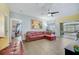 Spacious living room with a sectional sofa and access to the balcony at 4849 Cypress Woods Dr # 1310, Orlando, FL 32811