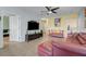 Open living area with sectional sofa and view into another living space at 4849 Cypress Woods Dr # 1310, Orlando, FL 32811