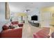 Open living area with sectional sofa and view into another living space at 4849 Cypress Woods Dr # 1310, Orlando, FL 32811