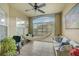 Bright sunroom with a hammock, comfy seating, and plenty of natural light at 4849 Cypress Woods Dr # 1310, Orlando, FL 32811