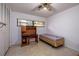 Small bedroom with a twin bed, built-in desk, and ample closet space at 5021 Saint Michael Ave, Belle Isle, FL 32812