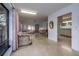 Living area with sofas, large windows, and view to kitchen at 5021 Saint Michael Ave, Belle Isle, FL 32812