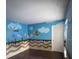 Bedroom with playful Mario theme wall mural and dark laminate flooring at 513 Harvard Pl, Apopka, FL 32703